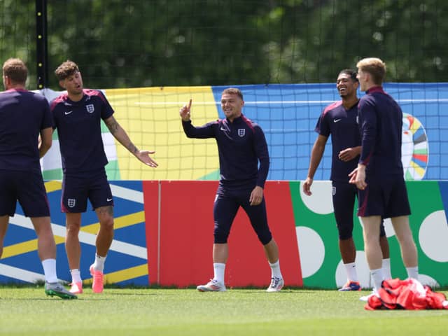 (From L) England's forward #09 Harry Kane, England's defender #12 Kieran Trippier, England's defender #05 John Stones, England's midfielder #10 Jude Bellingham and England's forward #18 Anthony Gordon attend a MD-1 training session during the UEFA Euro 2024 European Football Championship, at the team's base camp in Blankenhain, Thuringia, on June 24, 2024, on the eve of their UEFA Euro 2024 Group C football match against Slovenia. (Photo by Adrian DENNIS / AFP) (Photo by ADRIAN DENNIS/AFP via Getty Images)