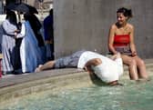 Tourists refresh themselves in the water of a fountain in downtown Rome in 2005 (Photo: VINCENZO PINTO/AFP via Getty Images)