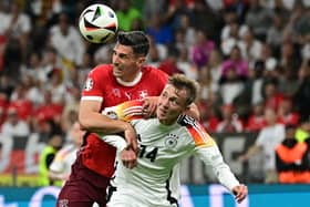 Switzerland's defender #22 Fabian Schar and Germany's forward #14 Maximilian Beier fight for the ball during the UEFA Euro 2024 Group A football match between Switzerland and Germany at the Frankfurt Arena in Frankfurt am Main on June 23, 2024. (Photo by Tobias SCHWARZ / AFP) (Photo by TOBIAS SCHWARZ/AFP via Getty Images)