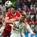 Switzerland's defender #22 Fabian Schar and Germany's forward #14 Maximilian Beier fight for the ball during the UEFA Euro 2024 Group A football match between Switzerland and Germany at the Frankfurt Arena in Frankfurt am Main on June 23, 2024. (Photo by Tobias SCHWARZ / AFP) (Photo by TOBIAS SCHWARZ/AFP via Getty Images)