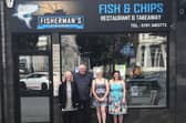 The Harkus family outside of Fisherman's Catch shortly after they opened the business in 2020.