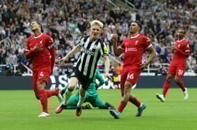 Anthony Gordon scoring for Newcastle United against Liverpool. 