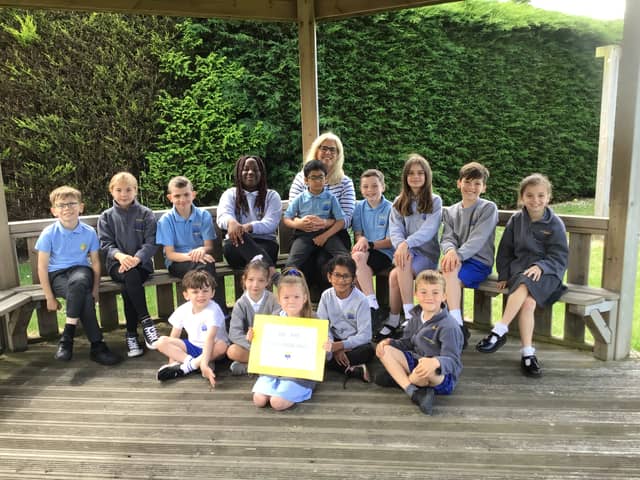 Headteacher Carol Devine with pupils at St Bede’s Catholic Primary School. The school has received an 'Outstanding' rating following an inspection by Ofsted.