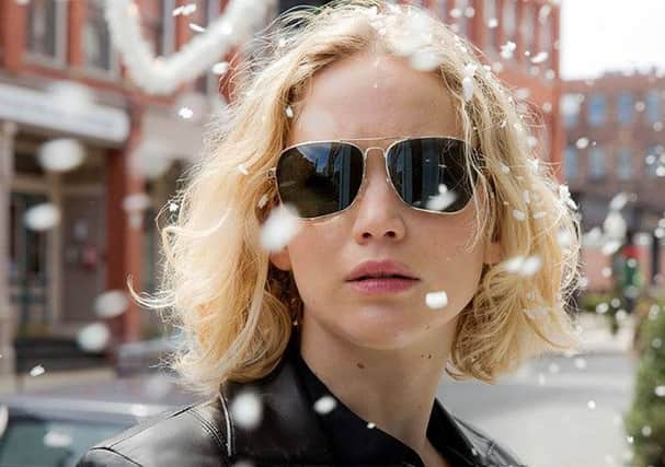 Jennifer Lawrence wearing gold-framed aviators in the movie Joy