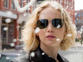 Jennifer Lawrence wearing gold-framed aviators in the movie Joy