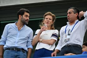 Newcastle United’s English minority owner Amanda Staveley and her husband Mehrdad Ghodoussi chat with Chelsea’s owner US businessman Behdad Eghbali (Photo by GLYN KIRK/AFP via Getty Images)