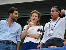 Newcastle United’s English minority owner Amanda Staveley and her husband Mehrdad Ghodoussi chat with Chelsea’s owner US businessman Behdad Eghbali (Photo by GLYN KIRK/AFP via Getty Images)
