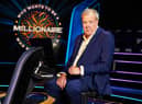 Jeremy Clarkson, sat in the host’s chair on set of Who Wants to be a Millionaire? (Credit: Stellify Media)