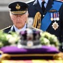 King Charles III walks behind the coffin of Queen Elizabeth II. Photo: Getty