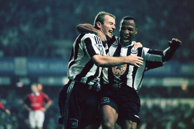 Newcastle strikers Alan Shearer and Les Ferdinand celebrate a goal the 5-0 win against Manchester United in October 1996 (Photo by Ben Radford/Getty Images)