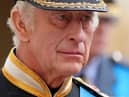 King Charles III follows the coffin of Queen Elizabeth II as it travels inside Windsor Castle on September 19. 