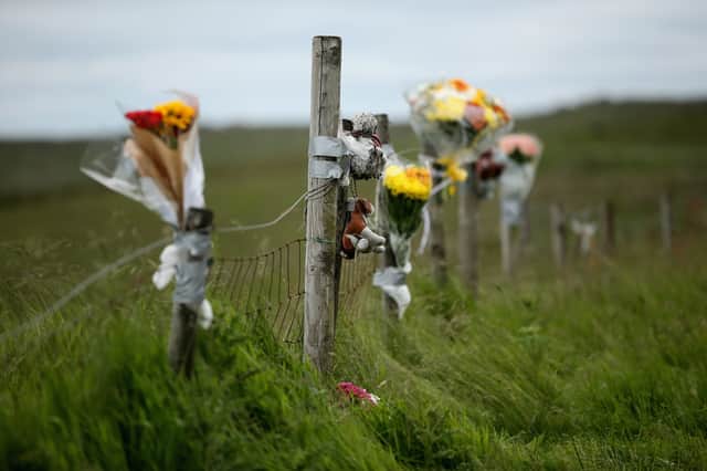 Floral tributes overlook Saddleworth Moor where the body of missing Keith Bennett may be buried on June 16, 2014 in Saddleworth.