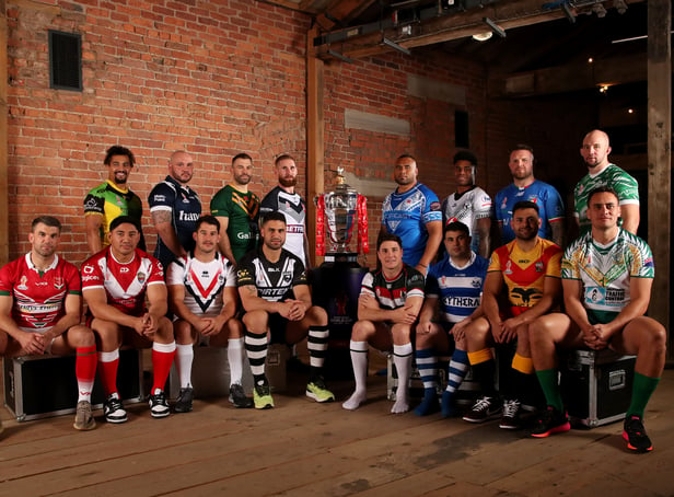 <p>The 16 captains with the Rugby League World Cup Trophy ahead of first round of fixtures</p>