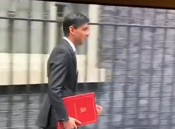 <p>Rishi Sunak leaves Downing Street in 2020 with a burgundy coloured ring binder.</p>