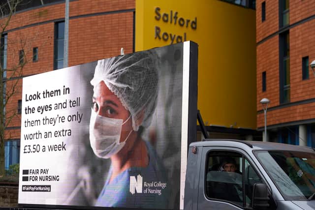 Responding to the government’s NHS pay proposal, the Royal College of Nursing has released a digital billboard message showing the image of a nurse in PPE with the message: ‘Look them in the eyes and tell them they’re only worth an extra £3.50 a week’ outside the Salford Royal hospital. 