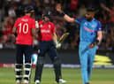 Alex Hales of England congratulates  Jos Buttler of England on his 50th run during the ICC Men's T20 World Cup Semi Final match between India and England at Adelaide Oval on November 10