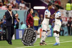 Marcus Rashford and Bukayo Saka of England are substituted during the FIFA World Cup Qatar 2022 Group B match between England and USA at Al Bayt Stadium on November 25, 2022 in Al Khor, Qatar. (Photo by Elsa/Getty Images)