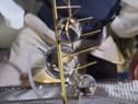 Liat Segal & Dr. Yasmine Meroz's artwork being unveiled on the ISS where microgravity allows the water to stick to the metal frame in large globules