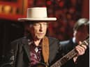Bob Dylan has issued a rare public apology for selling books with automated signatures.  