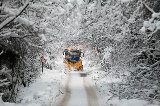 PERTH, SCOTLAND - DECEMBER 03: Tayside Contracts plough driver Iain Beedie clears rural roads in Perthshire on December 3, 2010 in Perth, Scotland. After heavy snowfall across the country resulting in severe disruption to Britain's infrastructure the country is now gripped by freezing temperatures. (Photo by Jeff J Mitchell/Getty Images)