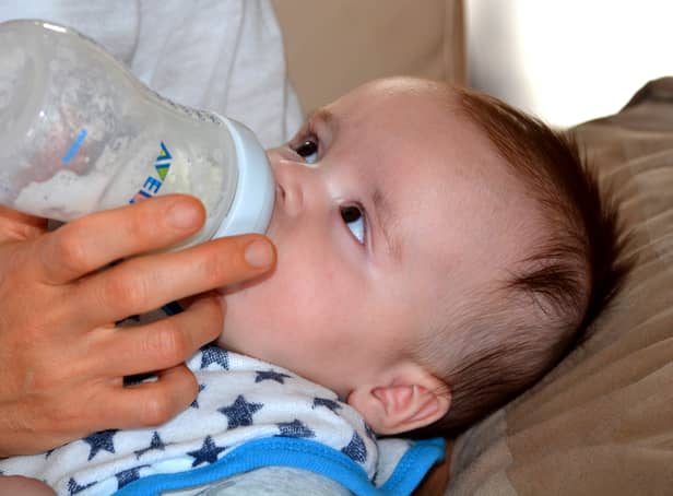 A baby drinks formula from a bottle. Pic: Pixabay.