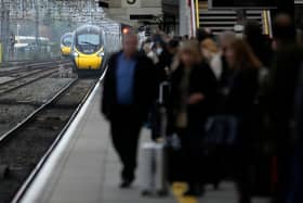 Passengers wait to board an Avanti West Coast mainline train at Crewe Station on December 01, 2022 in Crewe, England. The Rail, Maritime and Transport workers union (RMT) said its members will strike on eight days - December 13, 14, 16 and 17, and January 3, 4, 6 and 7 - the latest episode in a dispute over pay and working practices. (Photo by Christopher Furlong/Getty Images)