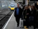 Passengers wait to board an Avanti West Coast mainline train at Crewe Station on December 01, 2022 in Crewe, England. The Rail, Maritime and Transport workers union (RMT) said its members will strike on eight days - December 13, 14, 16 and 17, and January 3, 4, 6 and 7 - the latest episode in a dispute over pay and working practices. (Photo by Christopher Furlong/Getty Images)