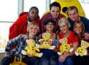 S Club 7 (L to R) Bradley Mcintosh, Paul Cattermolle, John Lee, Hannah Spearritt, Tina Barrett, Joe Omeara and Rachael Stephens pose for photographers November 15, 2001