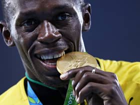 Gold medalist Usain Bolt of Jamaica stands on the podium during the medal ceremony for the Men’s 4 x 100 meter Relay on Day 15 of the Rio 2016 Olympic Games at the Olympic Stadium on August 20, 2016 in Rio de Janeiro, Brazil.  (Photo by Patrick Smith/Getty Images)