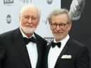 Honoree John Williams and director Steven Spielberg arrive at the American Film Institute’s 44th Life Achievement Award Gala Tribute to John Williams at Dolby Theatre on June 9, 2016 (Credit: Getty Images)