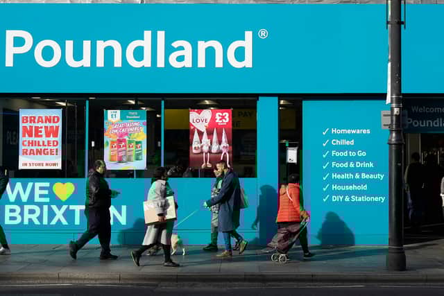 Pedestrians walk past a Poundland shop in Brixton, south London on February 7, 2022. - The Bank of England said Britain's annual inflation rate would peak at 7.25 percent in April, compared with 5.4 percent last December, which was already near a 30-year high. (Photo by Niklas HALLE'N / AFP) (Photo by NIKLAS HALLE'N/AFP via Getty Images)