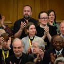 : Members of the General Synod react after blessings for same-sex couples was approved in a vote by the General Synod at The Church House.