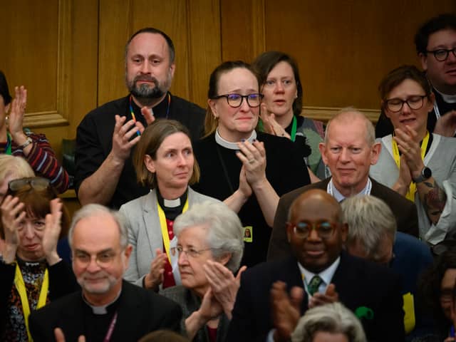 : Members of the General Synod react after blessings for same-sex couples was approved in a vote by the General Synod at The Church House.