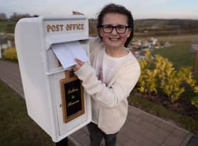 Matilda Handy, 9, and mum, Leanne Handy 45 with their letter box to heaven, in Gedling Crematorium, which allows grieving members of the public to write a letter to their loved ones who have passed away.  (Picture credit by SWNS)