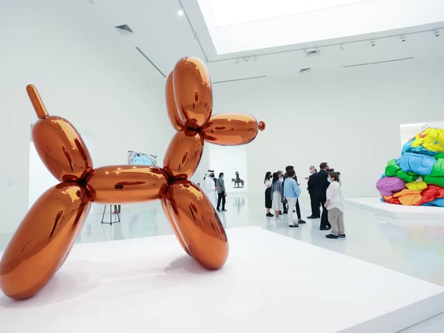A woman accidentally destroyed a Jeff Koons glass sculpture believing it to be a balloon dog.