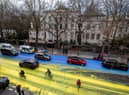 The Ukraine flag painted on the road outside the Russian Embassy in London (Photo: Led by Donkeys)