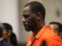 R&B singer R Kelly has an extra year added to his 30 year prison sentence for charges related to child enticement & indecent photos of children.