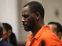R&B singer R Kelly has an extra year added to his 30 year prison sentence for charges related to child enticement & indecent photos of children.