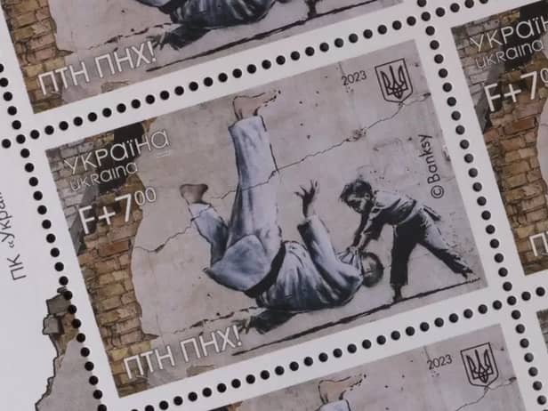 Ukraine postage stamps depicting a Banksy mural