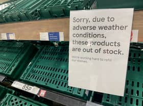 Empty shelves are seen in the fruit and vegetable aisles of a Tesco supermarket on February 22 in Burgess Hill.