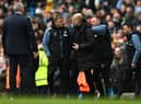 Newcastle United head coach Eddie Howe (left) & Manchester City boss Pep Guardiola. (Photo by Michael Regan/Getty Images)
