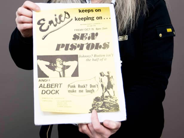 Claire Howell, music memorabilia consultant at Hansons Auctioneers, with the Sex Pistols poster.  