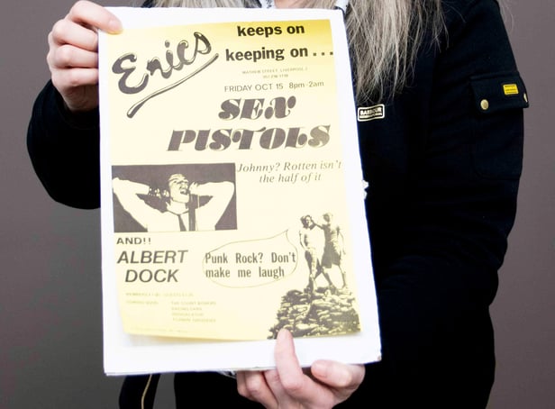 <p>Claire Howell, music memorabilia consultant at Hansons Auctioneers, with the Sex Pistols poster.  </p>