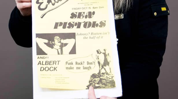 Claire Howell, music memorabilia consultant at Hansons Auctioneers, with the Sex Pistols poster.  