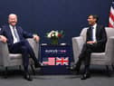 US President Joe Biden and British Prime Minister Rishi Sunak participate in a bilateral meeting during the AUKUS summit on March 13, 2023 in San Diego, California. President Biden hosts British Prime Minister Rishi Sunak and Australian Prime Minister Anthony Albanese in San Diego for an AUKUS meeting to discuss the procurement of nuclear-powered submarines under a pact between the three nations. (Photo by Leon Neal/Getty Images)