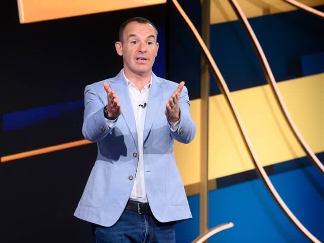 Martin Lewis pictured on set of The Martin Lewis Money Show, gesturing to the audience (Credit: Multistory Media/Jonathan Hordle/ITV)