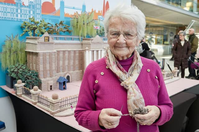 A 93-year-old great-great-gran who has a British Empire Medal (BEM) for her knitting has since created a massive 6ft Buckingham Palace out of wool.