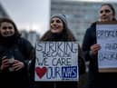 NHS physiotherapists take part in a strike outside of St Thomas’ Hospital on January. (Photo by Carl Court/Getty Images)