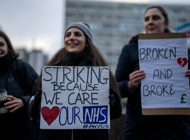 NHS physiotherapists take part in a strike outside of St Thomas’ Hospital on January. (Photo by Carl Court/Getty Images)