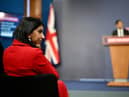 Suella Braverman listens on as prime minister Rishi Sunak announces the Illegal Migration Bill
